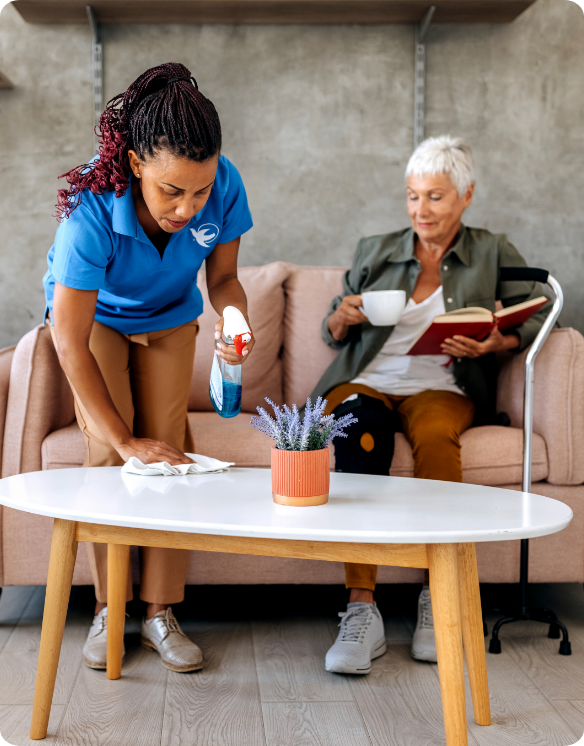 A Visiting Angels caregiver and an elderly man engaging in a thoughtful conversation, illustrating support and connection for individuals with Alzheimer's.